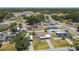A birds-eye view shows a well-maintained home in a tranquil neighborhood with mature trees and fencing at 2830 Anthony St, Tampa, FL 33619