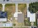 Aerial view of a home showcasing its roof, yard, and surrounding neighborhood, providing a sense of the property's layout at 2830 Anthony St, Tampa, FL 33619