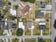 An aerial perspective shows homes neatly arranged in a grid pattern with a mix of roofing styles and yards at 2830 Anthony St, Tampa, FL 33619