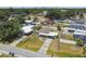Aerial view of a single Gathering home with fenced yard and mature trees in a residential neighborhood at 2830 Anthony St, Tampa, FL 33619