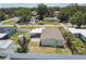 Charming single Gathering home with a spacious yard and carport nestled in a suburban neighborhood surrounded by trees at 2830 Anthony St, Tampa, FL 33619