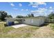 The backyard of the home featuring a patio and white fencing at 2830 Anthony St, Tampa, FL 33619