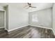 Bedroom features wood-look floors, neutral walls, and a window at 2830 Anthony St, Tampa, FL 33619