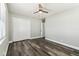 This is a standard bedroom with hardwood floors, a ceiling fan, closet and a window for natural light at 2830 Anthony St, Tampa, FL 33619