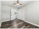 Bedroom featuring wood-look flooring, a ceiling fan, and a closet at 2830 Anthony St, Tampa, FL 33619