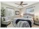 Comfortable bedroom featuring a plush rug, inviting accent chair, and a beautifully coordinated bed set at 2830 Anthony St, Tampa, FL 33619