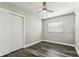Bedroom with a ceiling fan, wood-look flooring, and a closet at 2830 Anthony St, Tampa, FL 33619