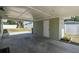 This is a view of the carport and a partial view of the backyard at 2830 Anthony St, Tampa, FL 33619