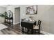 Dining space featuring a black drop-leaf table set for two, with modern decor at 2830 Anthony St, Tampa, FL 33619