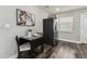 Eat-in kitchen with a black drop-leaf table set for two, and stainless steel refrigerator at 2830 Anthony St, Tampa, FL 33619