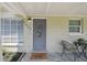 Welcoming front entrance with seating, a decorative door, and an inviting atmosphere at 2830 Anthony St, Tampa, FL 33619