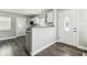 Bright kitchen featuring white cabinets, subway tile backsplash, and granite countertops at 2830 Anthony St, Tampa, FL 33619