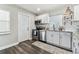 Modern kitchen with stainless steel appliances, white cabinets, and subway tile backsplash at 2830 Anthony St, Tampa, FL 33619