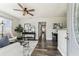 Bright living room featuring stylish decor, modern lighting, and hardwood floors at 2830 Anthony St, Tampa, FL 33619