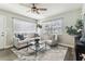 Comfortable living room featuring a plush sofa, stylish accents, and sunlit windows at 2830 Anthony St, Tampa, FL 33619