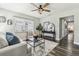 Inviting living room with a ceiling fan, ample natural light, and contemporary furnishings at 2830 Anthony St, Tampa, FL 33619
