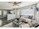 Cozy living room featuring dark wood floors and a modern ceiling fan at 2830 Anthony St, Tampa, FL 33619