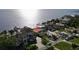 Waterfront home featuring lush landscaping, a private dock, and stunning views of the bay at 3227 Bayshore Ne Blvd, St Petersburg, FL 33703