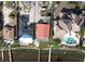 Aerial view of a waterfront property highlighting damage to the roof and surrounding area at 3227 Bayshore Ne Blvd, St Petersburg, FL 33703