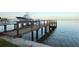 Dock with railings offering deep water access for boating and stunning waterfront views at 3227 Bayshore Ne Blvd, St Petersburg, FL 33703