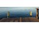 Wooden dock with sturdy posts leading to serene water views, perfect for relaxation at 3227 Bayshore Ne Blvd, St Petersburg, FL 33703