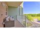 A cozy balcony offers a spot to unwind outdoors with a scenic neighborhood view at 3282 Mangrove Point Dr, Ruskin, FL 33570