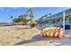 The beach bar has kayaks, beach umbrellas and chairs, and beach access at 3282 Mangrove Point Dr, Ruskin, FL 33570