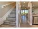 Hallway and staircase leading to the kitchen and living area at 3282 Mangrove Point Dr, Ruskin, FL 33570
