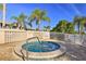 Community hot tub with manicured outdoor space with views of the neighborhood and palm trees adding to the ambiance at 3282 Mangrove Point Dr, Ruskin, FL 33570