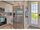 Modern kitchen featuring stainless steel appliances and a spacious refrigerator at 3282 Mangrove Point Dr, Ruskin, FL 33570