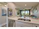 Bright kitchen with stainless steel appliances, granite counters, and an open concept layout at 3282 Mangrove Point Dr, Ruskin, FL 33570