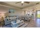 Inviting living room featuring a comfortable sofa and open to the dining area at 3282 Mangrove Point Dr, Ruskin, FL 33570