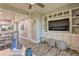 Spacious living area with built-in shelving and adjacent dining and kitchen area at 3282 Mangrove Point Dr, Ruskin, FL 33570