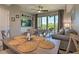 Open concept living and dining area with sliding glass doors to a balcony with a view at 3282 Mangrove Point Dr, Ruskin, FL 33570