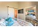 This main bedroom showcases a sliding barn door and decorative mirror closet at 3282 Mangrove Point Dr, Ruskin, FL 33570