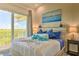 Inviting main bedroom with access to balcony and nautical decor at 3282 Mangrove Point Dr, Ruskin, FL 33570