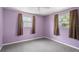 Cozy bedroom with carpeting, natural light, and comfortable space at 3348 Clydesdale Dr, Holiday, FL 34691