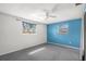 Airy bedroom featuring carpeting, ample natural light, and versatile design options at 3348 Clydesdale Dr, Holiday, FL 34691