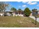 Charming single-story home features a well-manicured lawn and inviting front porch at 3348 Clydesdale Dr, Holiday, FL 34691