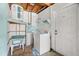 Practical laundry room with vintage washer and dryer and water heater at 3348 Clydesdale Dr, Holiday, FL 34691