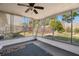 Enclosed porch with screen windows and a view of the backyard landscape at 3348 Clydesdale Dr, Holiday, FL 34691