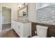 Bathroom with dual vanity, granite countertop, decorative mirror, and blue tile backsplash at 3351 Bristol Pl, Tarpon Springs, FL 34688