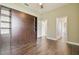 Bedroom with a Murphy bed, closet, and hardwood floors at 3351 Bristol Pl, Tarpon Springs, FL 34688