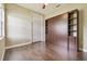 Bedroom with a Murphy bed, closet, and hardwood floors at 3351 Bristol Pl, Tarpon Springs, FL 34688