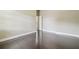 Bedroom with hardwood floors, white trim, and a white door at 3351 Bristol Pl, Tarpon Springs, FL 34688