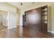 Bedroom with a Murphy bed, closet, and hardwood floors at 3351 Bristol Pl, Tarpon Springs, FL 34688