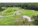Scenic aerial view of the golf course with rolling hills, sand traps, and well-manicured greens at 3351 Bristol Pl, Tarpon Springs, FL 34688