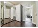 Hallway featuring ample storage and a decorative glass block window for natural lighting at 3351 Bristol Pl, Tarpon Springs, FL 34688