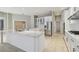 Modern kitchen with an island, stainless steel appliances, and white cabinets at 3351 Bristol Pl, Tarpon Springs, FL 34688