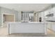 Spacious kitchen featuring an island, modern appliances, and an open layout at 3351 Bristol Pl, Tarpon Springs, FL 34688